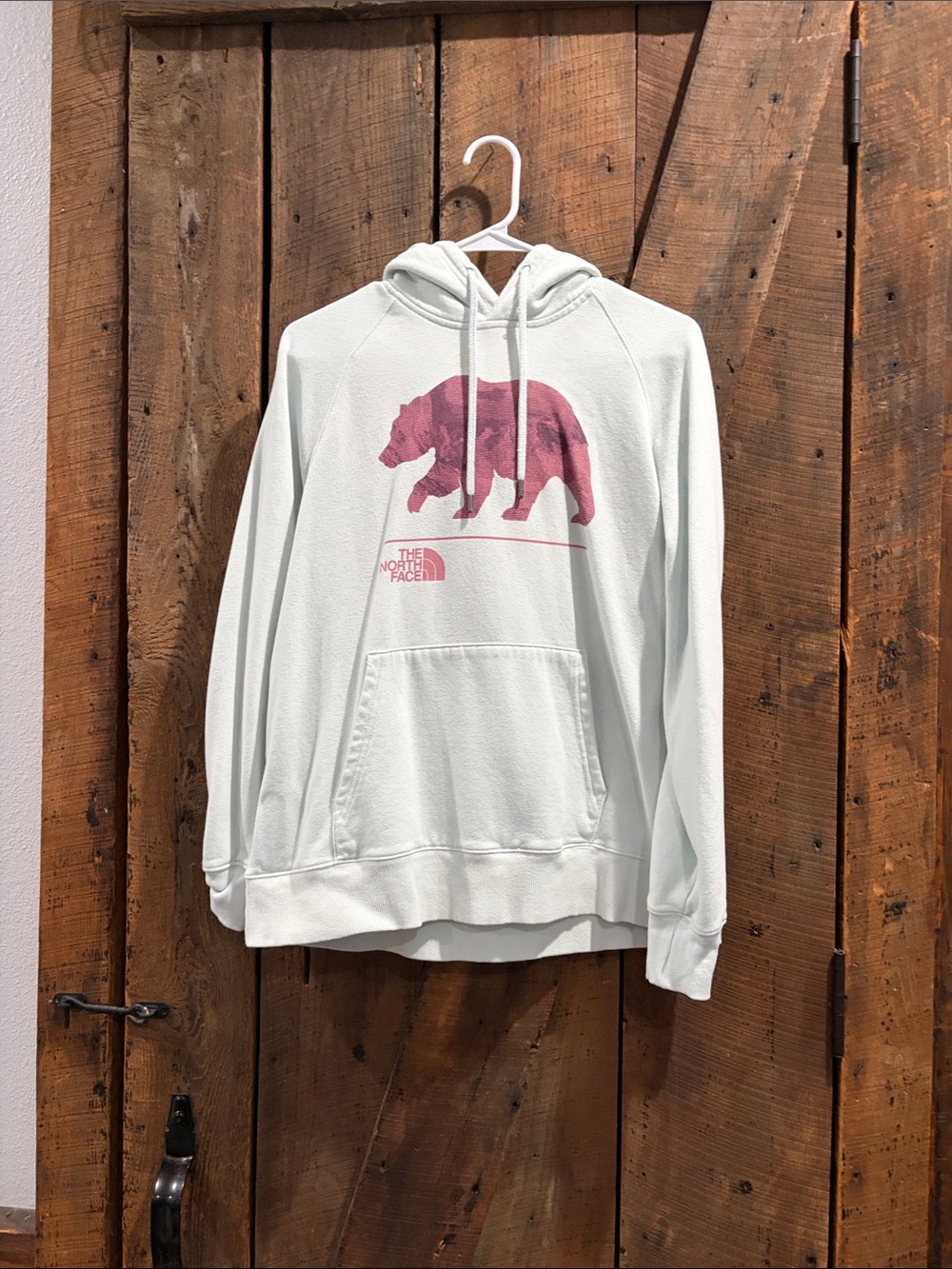 The North Face Woman’s Mint Green Crewneck Hoodie with Pink Bear Graphic